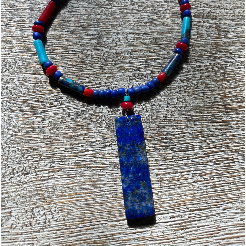 Lapis lazuli pendant necklace. Turquoise, red coral natural gemstone strand.